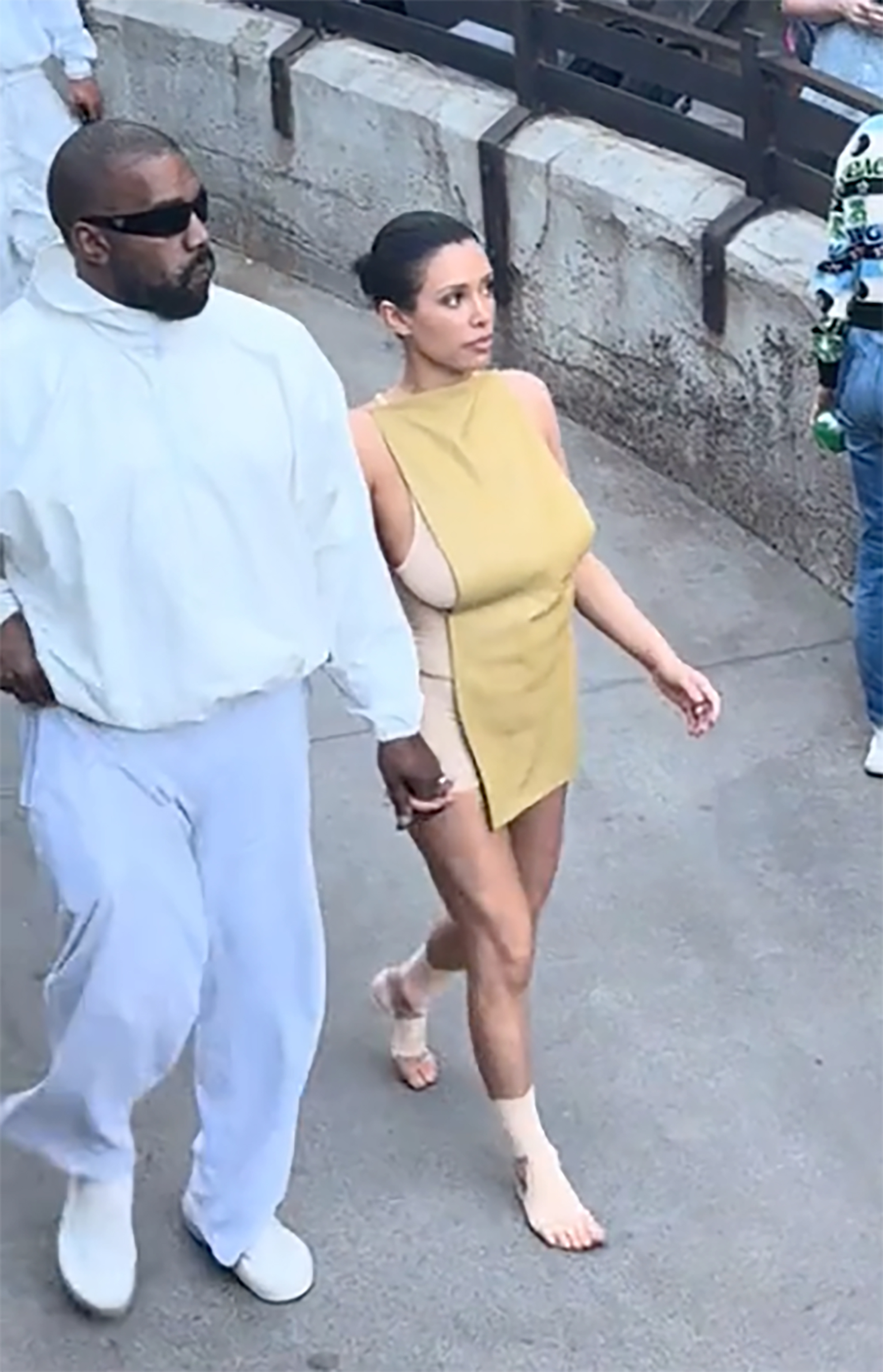Bianca Censori and Kanye West in Disneyland.