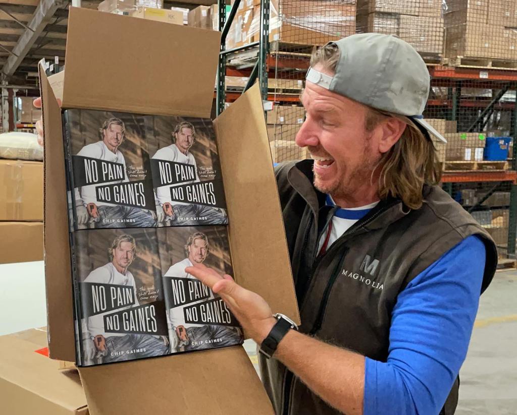 Chip Gaines with his book