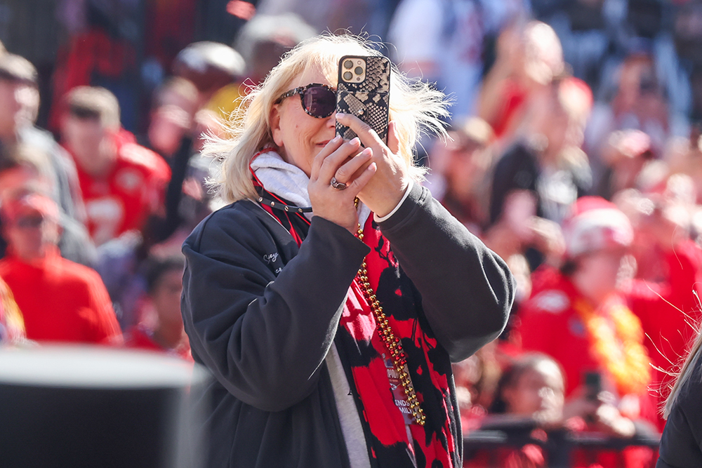 Donna Kelce taking a photo on her phone