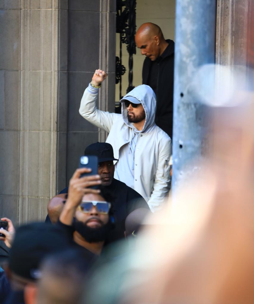 Eminem in a white hoodie.