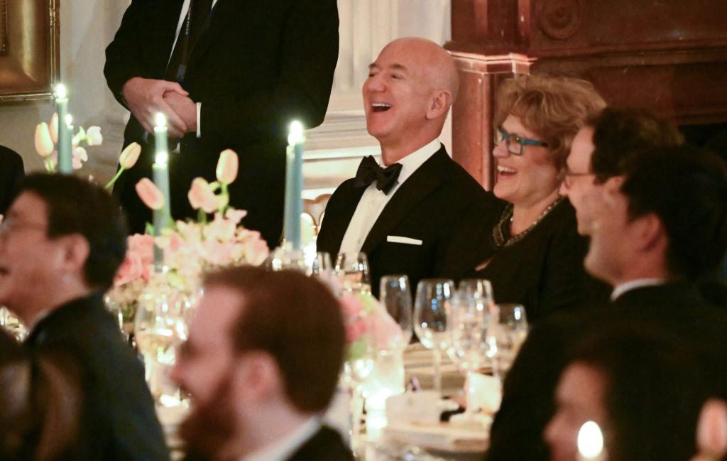 Jeff Bezos laughs during the White House state dinner.
