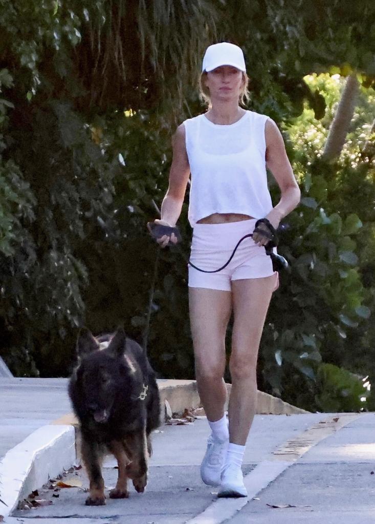 Gisele Bündchen walking her dog.