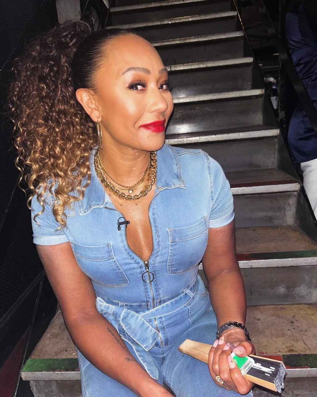 mel b sitting on steps