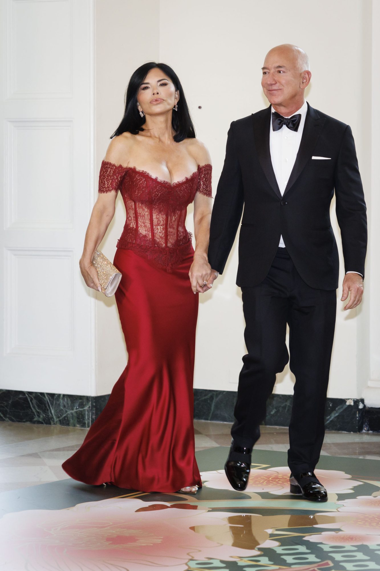 Jeff Bezos and Lauren Sanchez arrive to attend a state dinner.