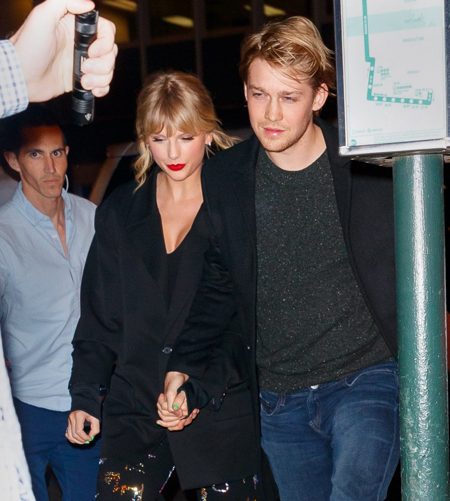 Taylor Swift and Joe Alwyn holding hands