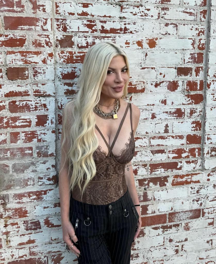 Tori Spelling in a lacy tank top.