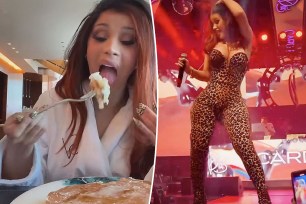 Cardi B eating pancakes split with her performing on stage.