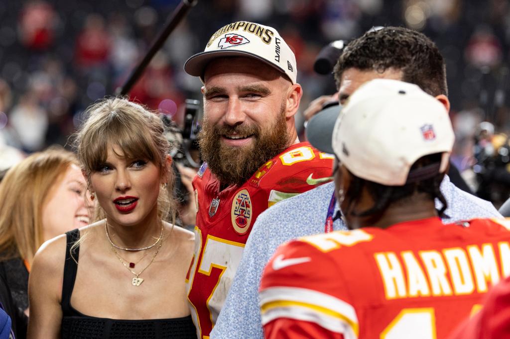 Taylor Swift kissing Travis Kelce after his game.