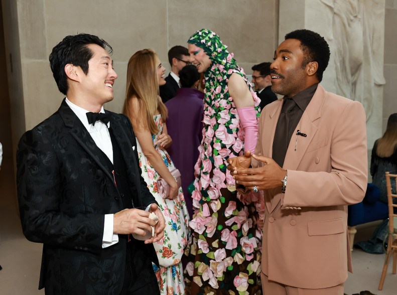 Steven Yeun and donald Glover inside the Met Gala 2024