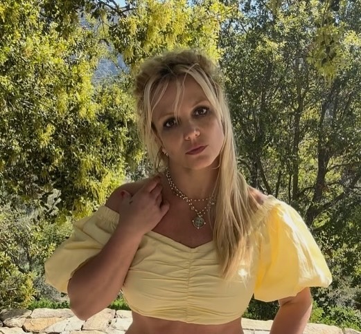 Britney Spears in a yellow top.