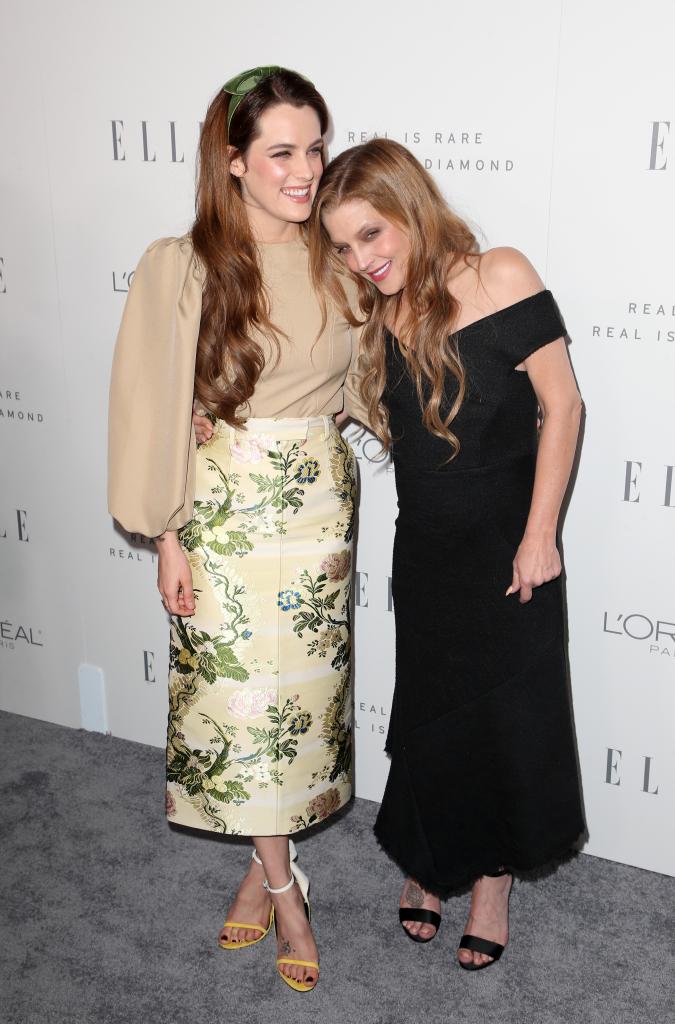 Riley Keough cuddles Lisa Marie Presley at an Elle magazine event in 2017.