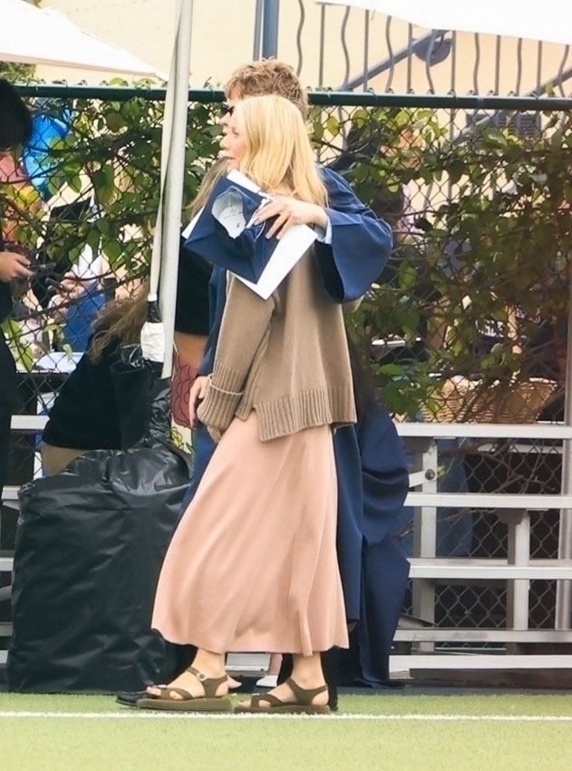 Gwyneth Paltrow with Moses at Moses' graduation. 