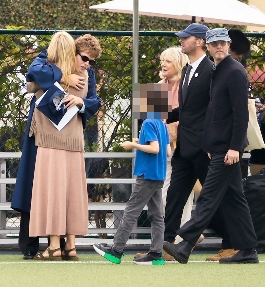 Gwyneth Paltrow hugging Moses at his graduation.