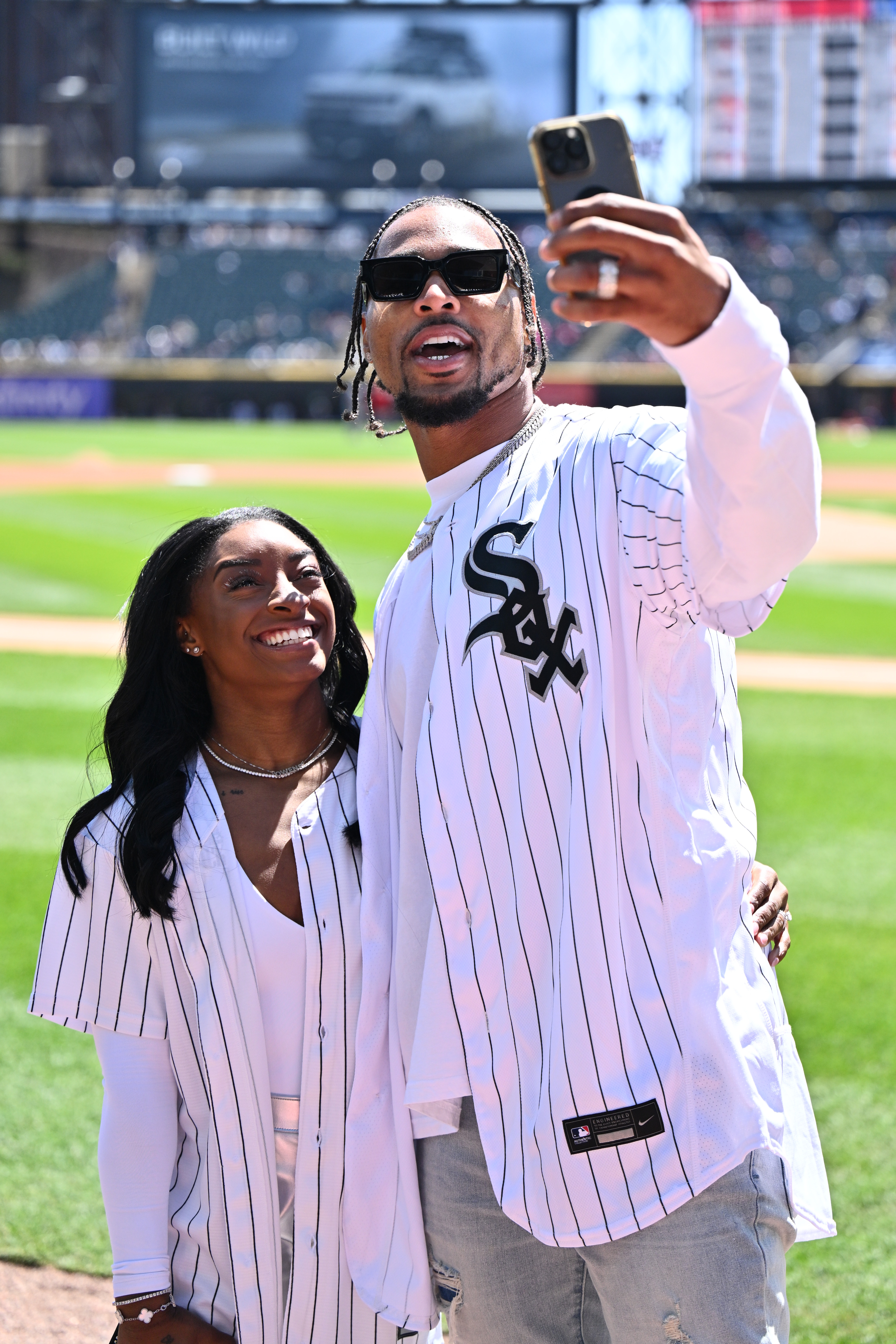 Simone Biles and Jonathan Owens taking a selfie