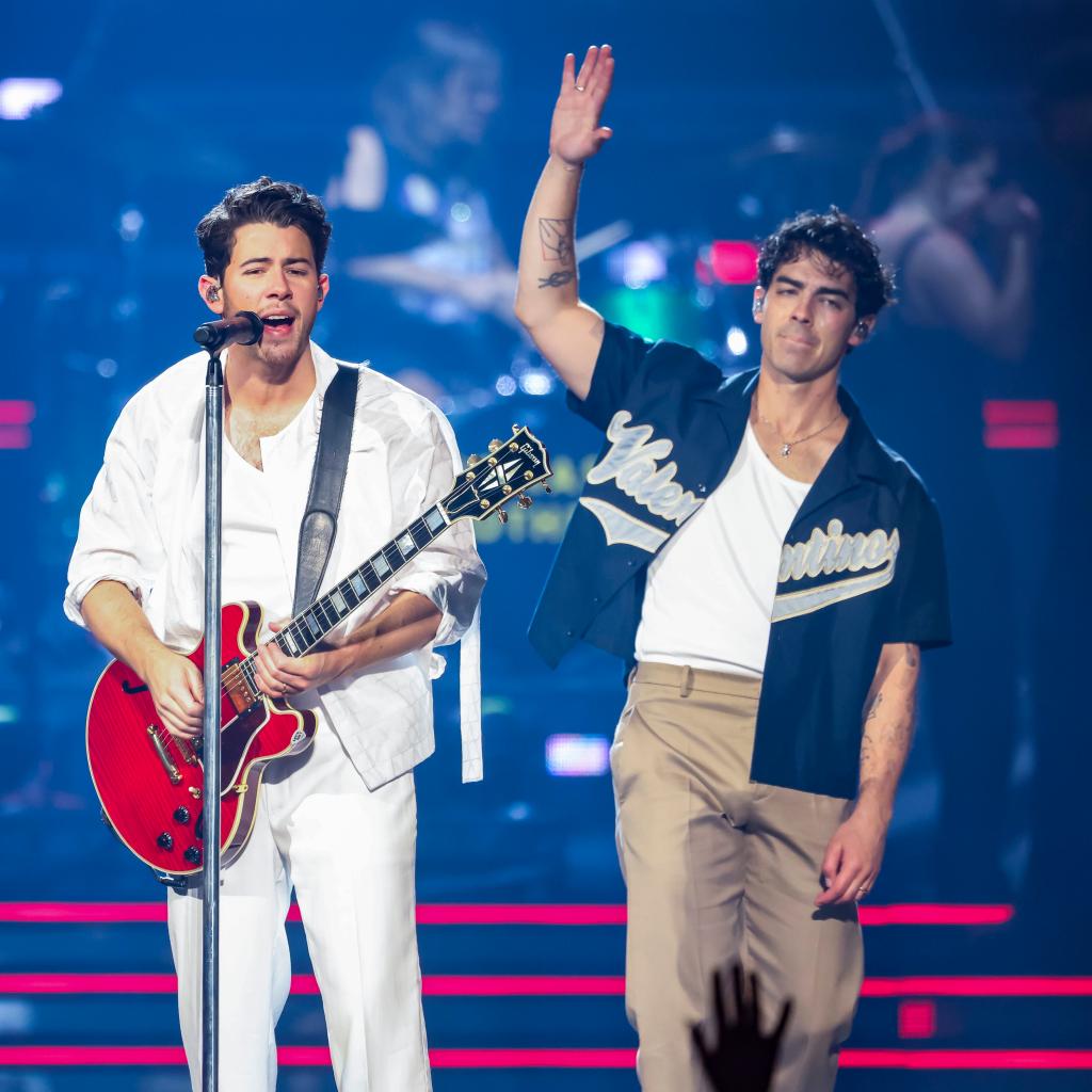 Joe Jonas performing with Nick Jonas