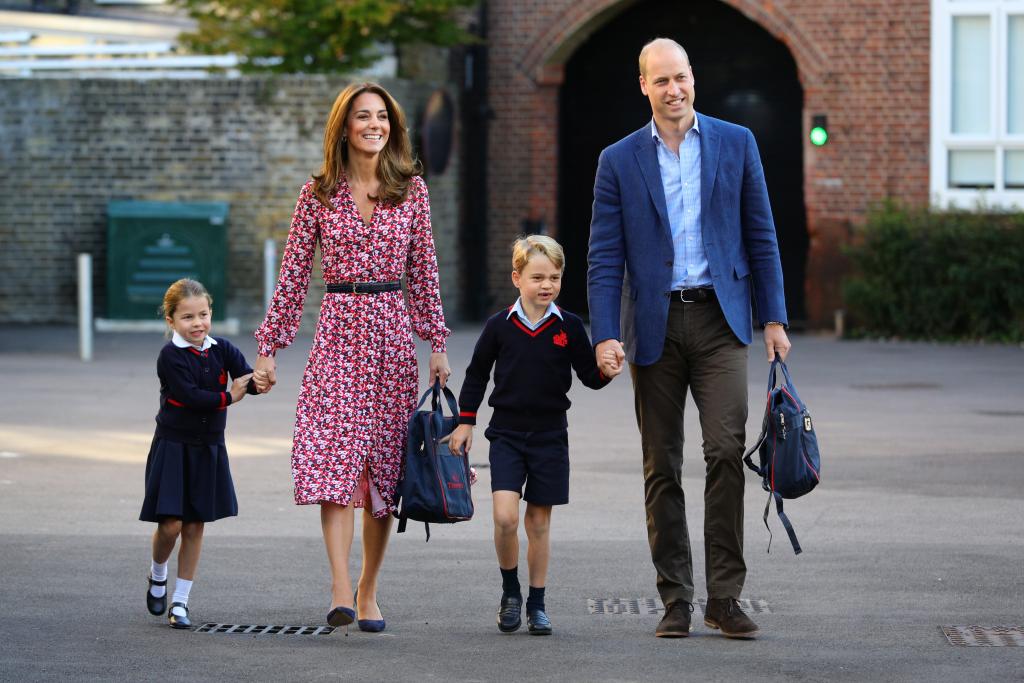 Kate Middleton and Prince William with two of their kids.