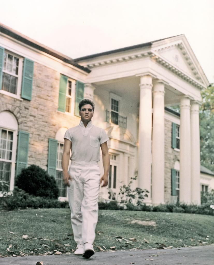 Elvis Presley strolls the grounds of his Graceland estate in 1957