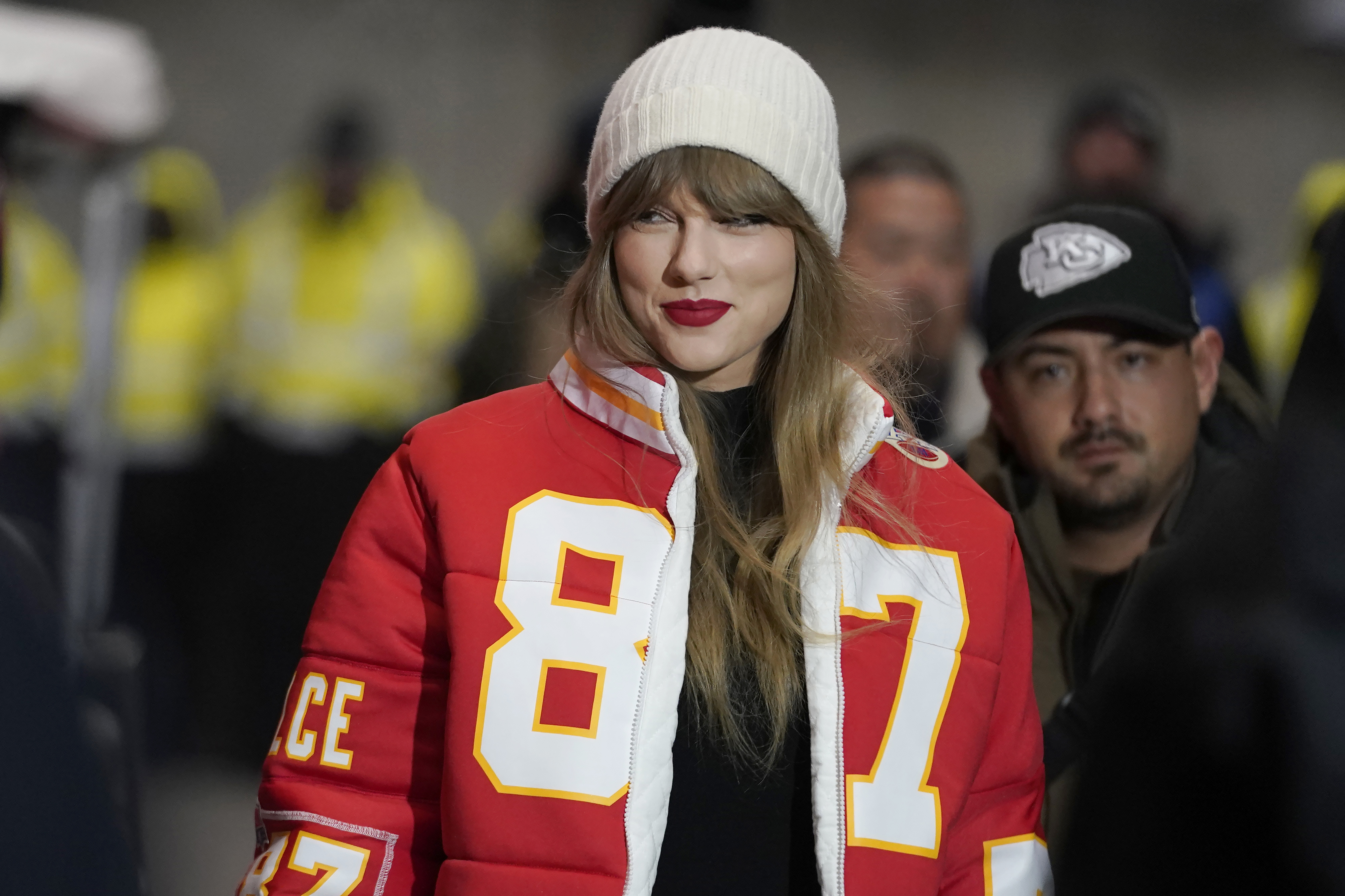 Taylor Swift wearing an No. 87 jacket.