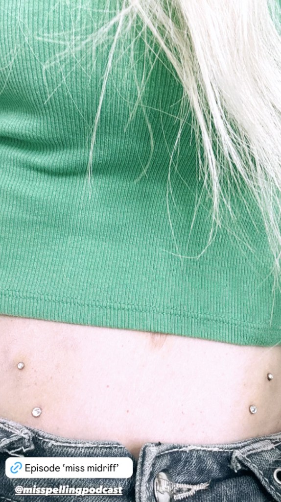 Tori Spelling's stomach piercings
