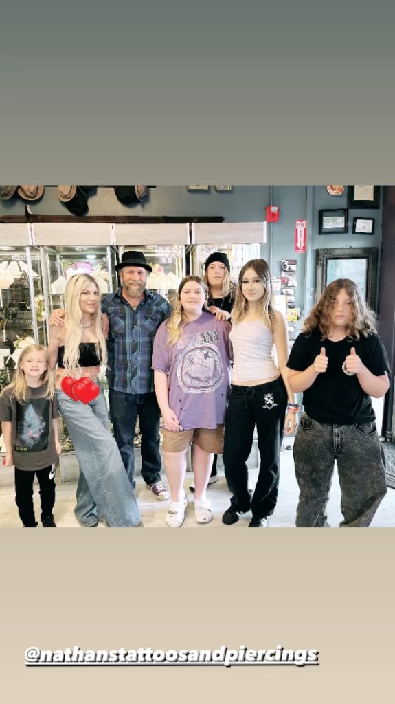 Tori Spelling getting stomach piercings with her kids for Mother's Day