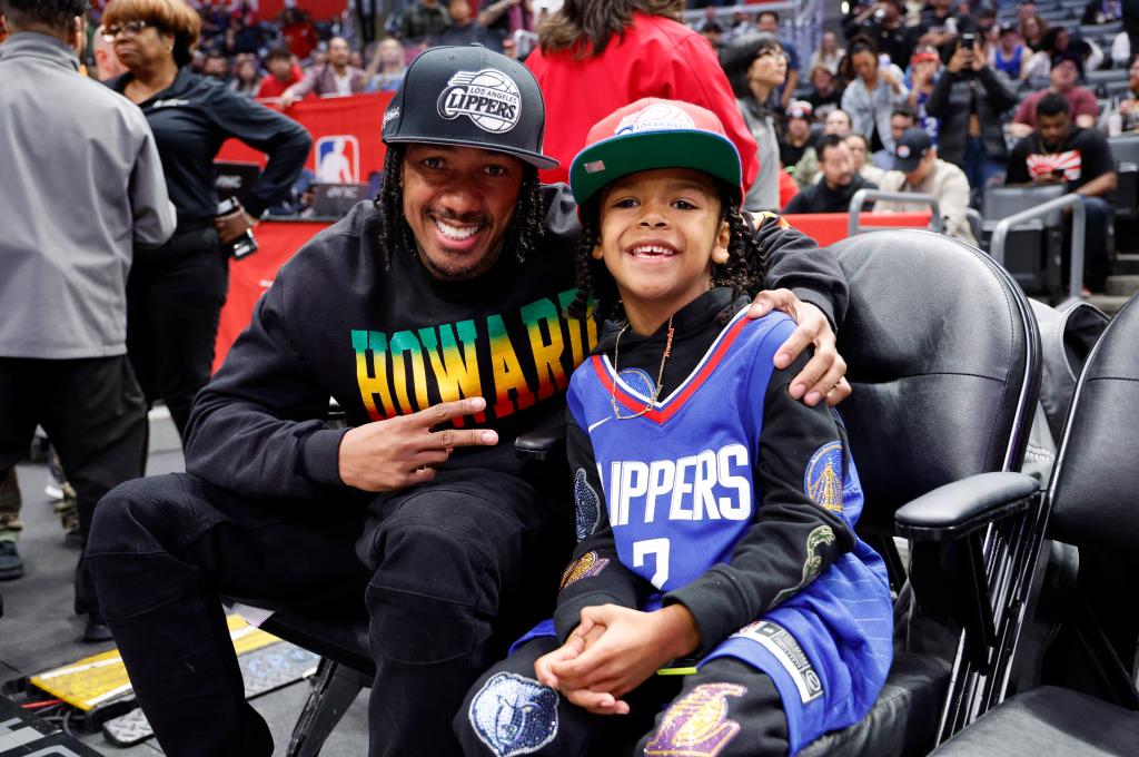 Nick Cannon and son Golden at a game.