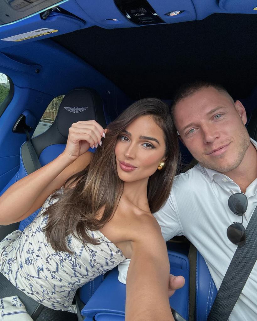 Olivia Culpo and Christian McCaffrey in a car selfie. 