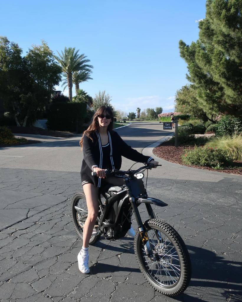 Nina Dobrev on a bike
