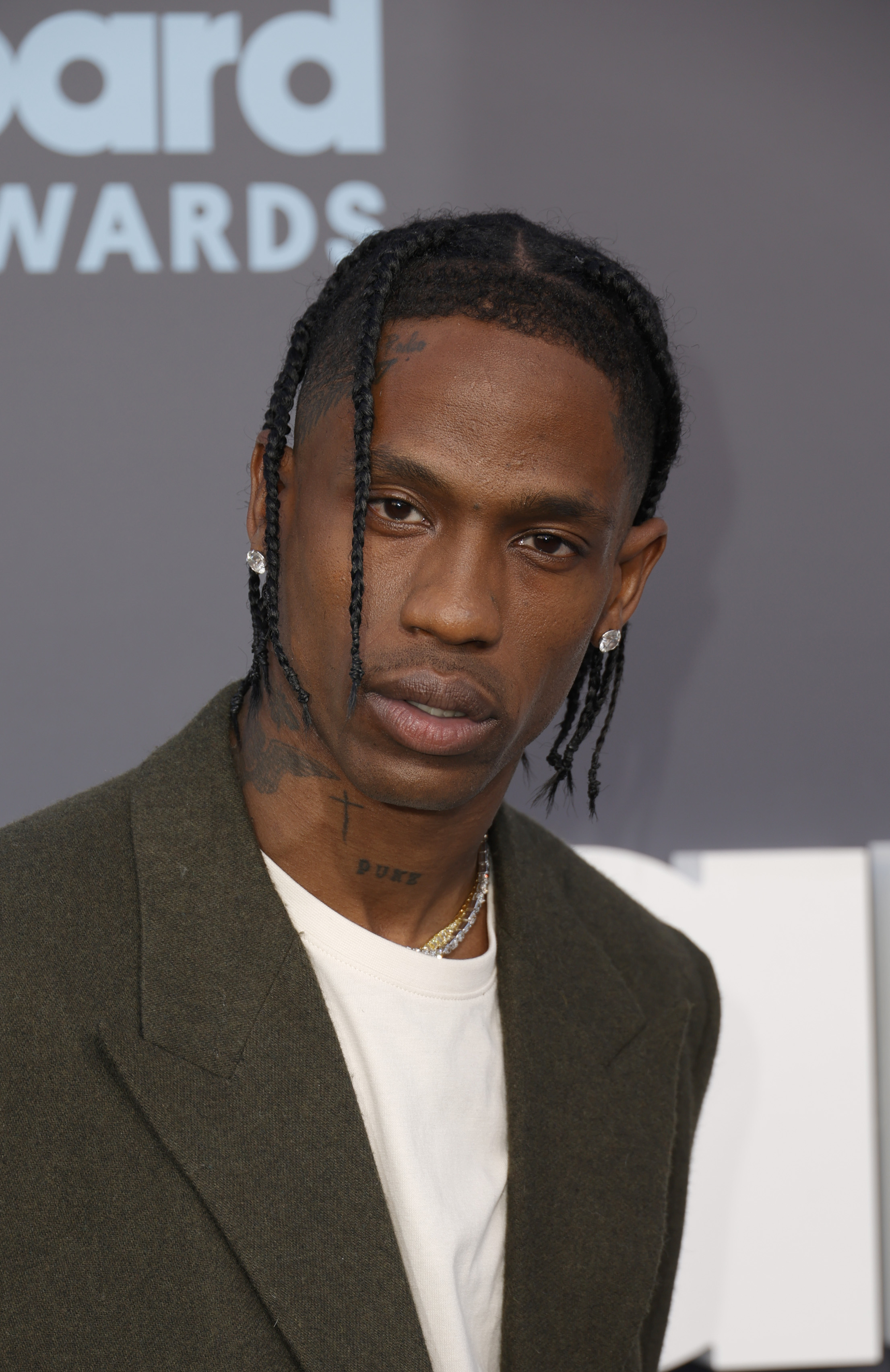 Travis Scott posing on a red carpet