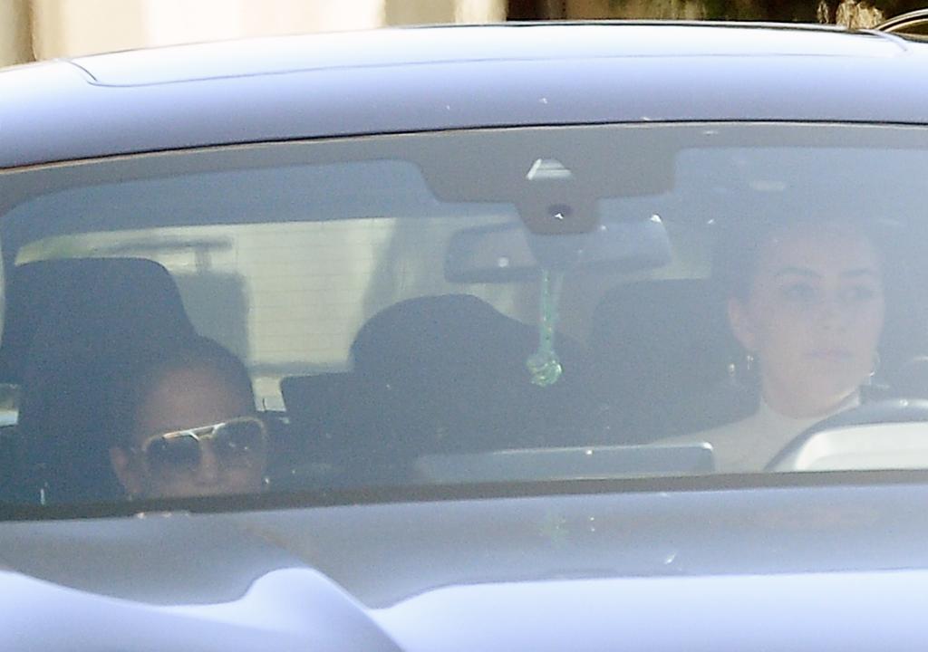 Jennifer Lopez in the passenger seat of a car