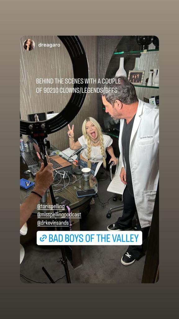 instagram photo of tori spelling giving the peace sign and sticking her tongue out standing next to dr. kevin sands