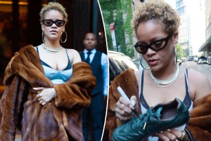 Rihanna wears her hair in natural curls