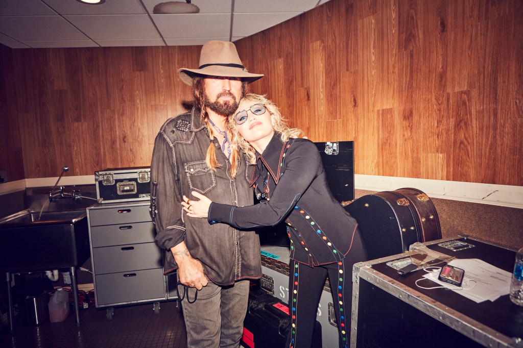 Miley Cyrus and Billy Ray Cyrus in n the studo. 