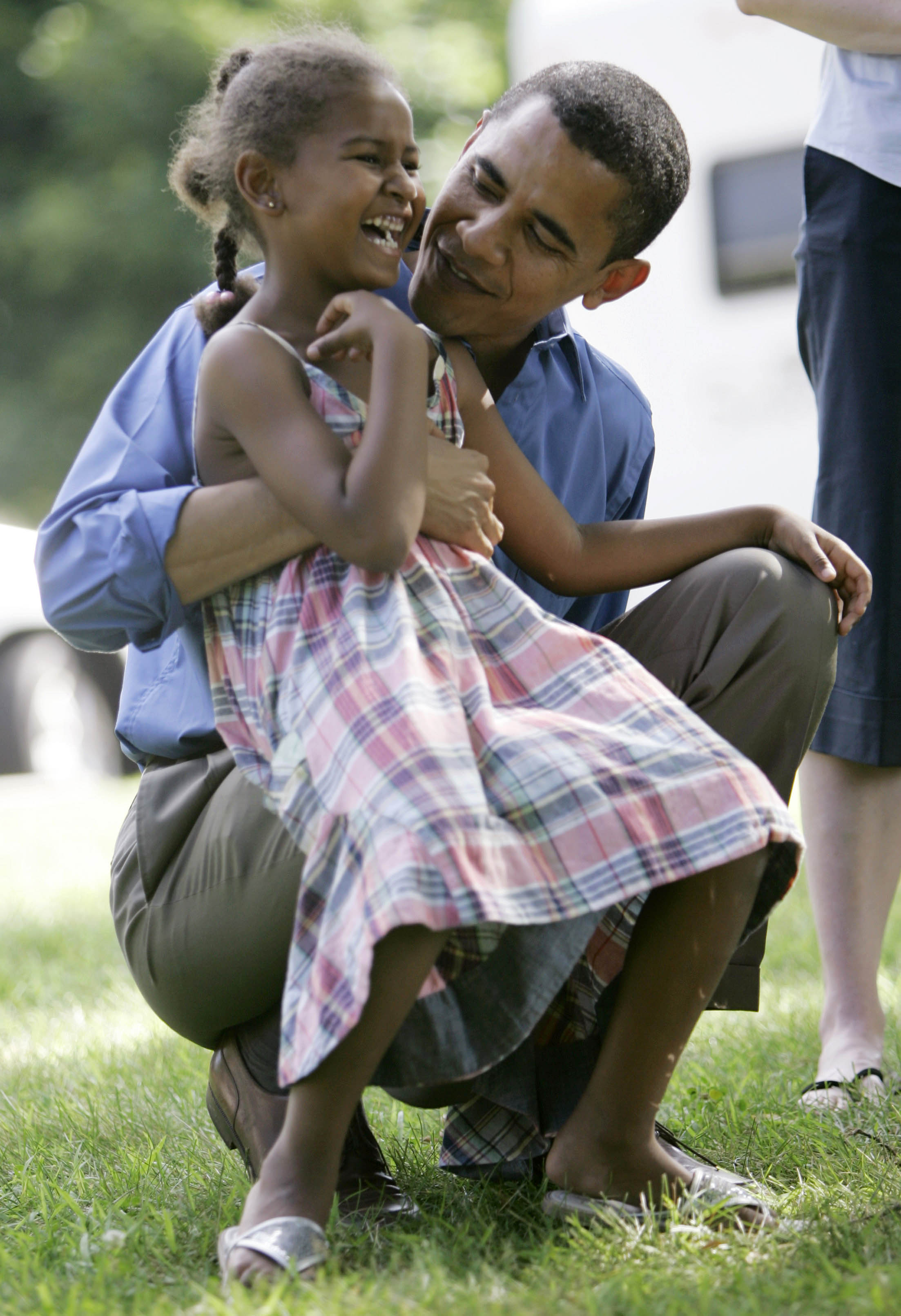 Barack Obama and Sasha Obama at a picnic in 2007.