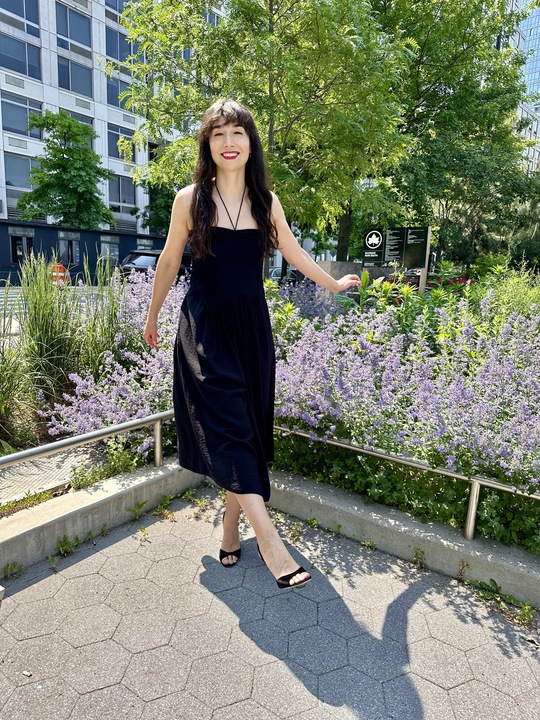 A woman wearing high heels in a park