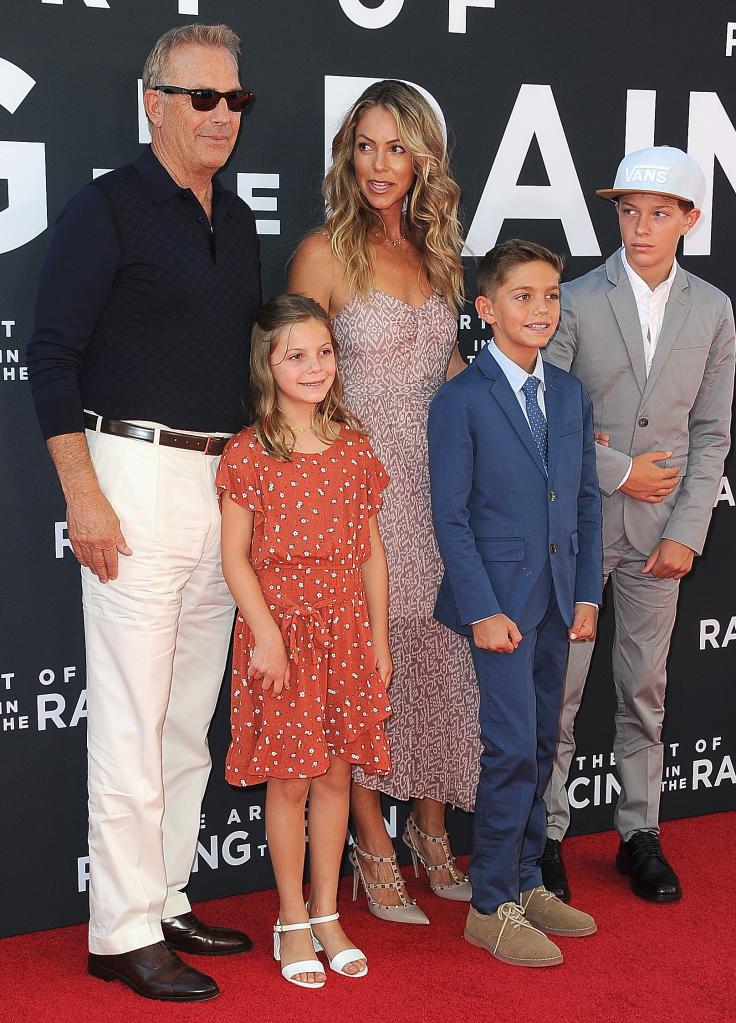 Christine Baumgartner and Kevin Costner with their kids