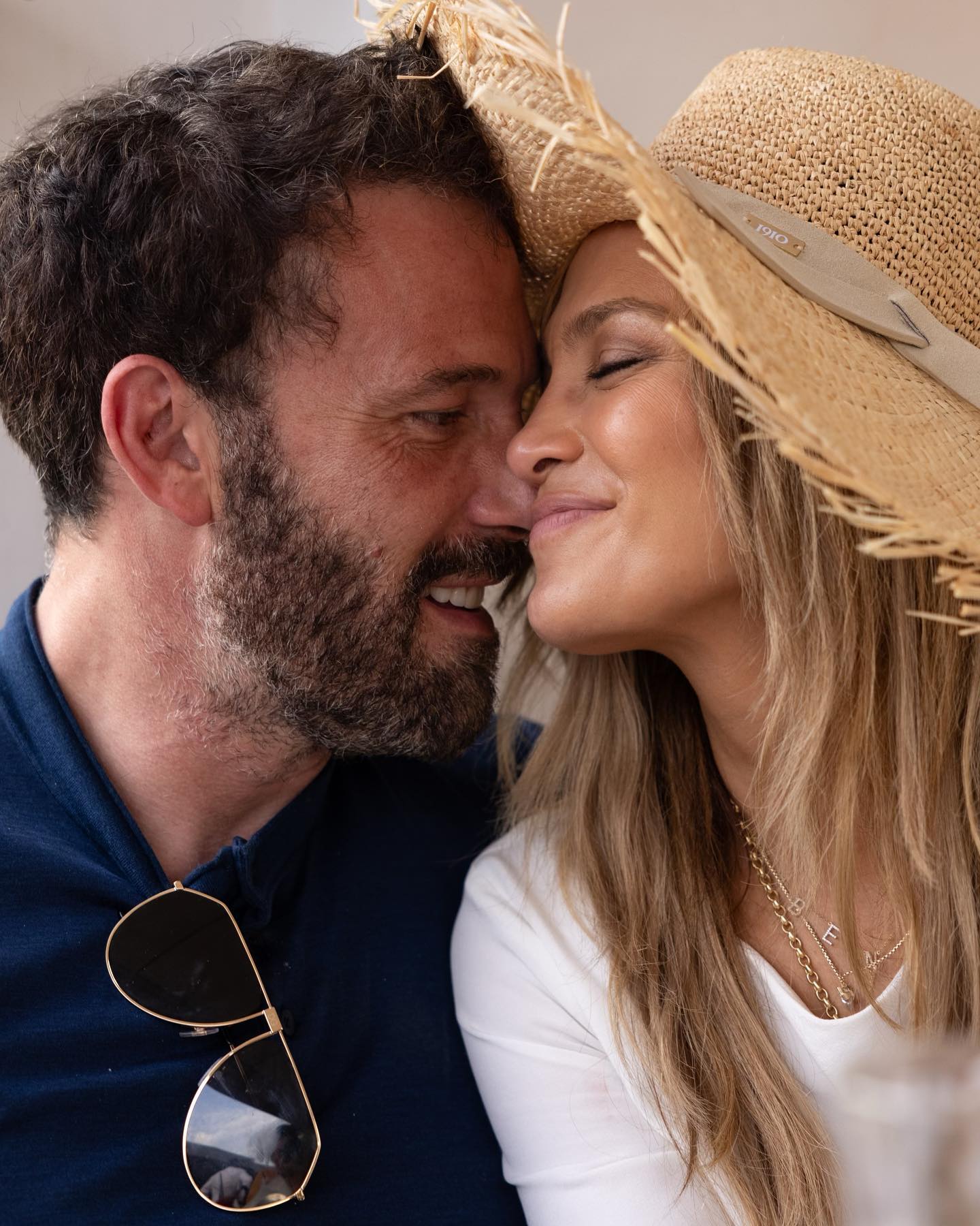 Jennifer Lopez and Ben Affleck smile.