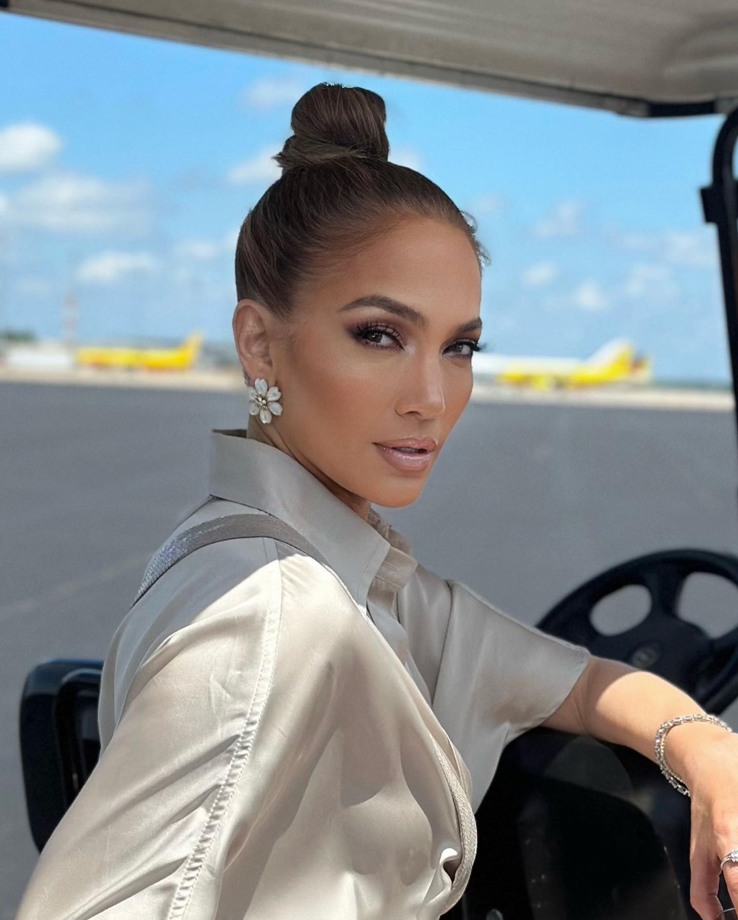 Jennifer Lopez poses for a photo on a boat.