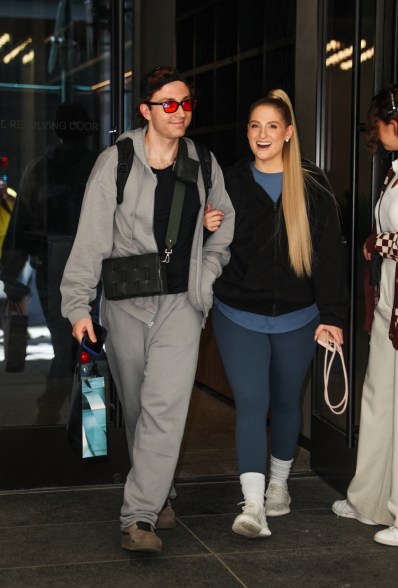 Meghan Trainor and her husband Daryl Sabara keep close while leaving "Watch What Happens Live" in New York City.