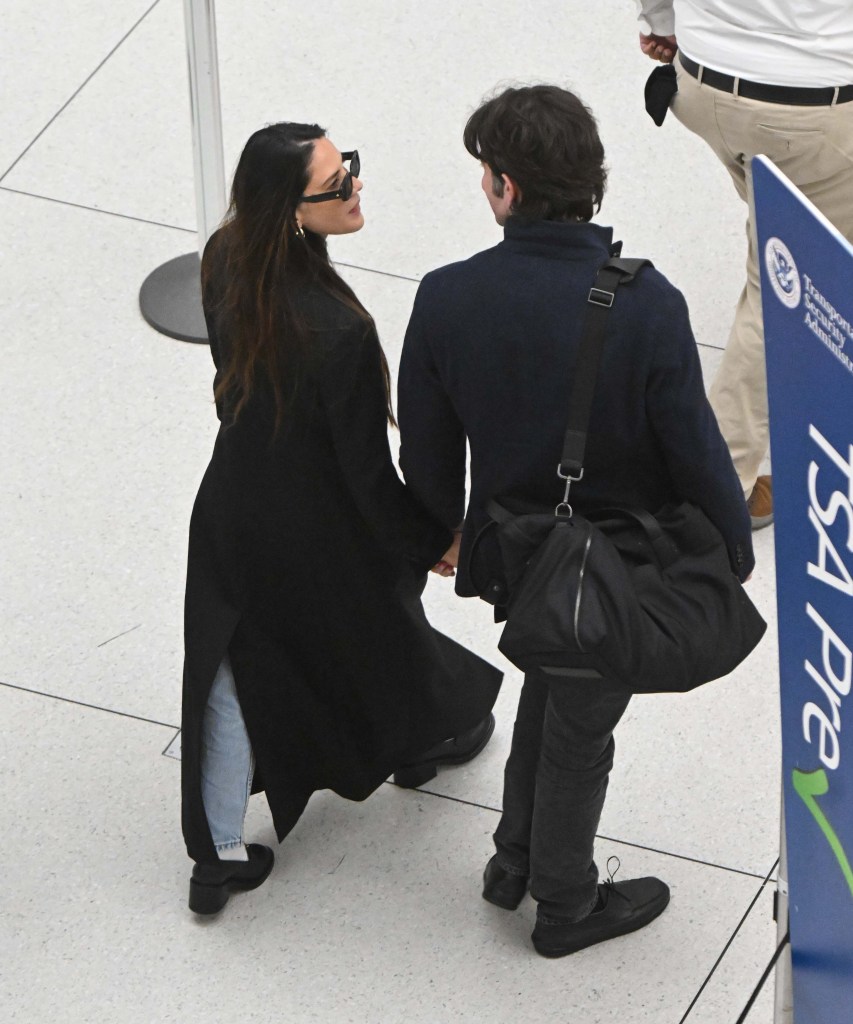 John Mulaney and Olivia Munn at JFK Airport. 