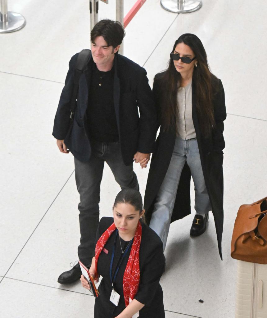 John Mulaney and Olivia Munn at JFK Airport. 