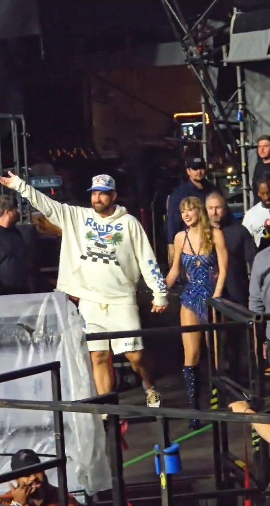 Travis Kelce and Taylor Swift holding hands