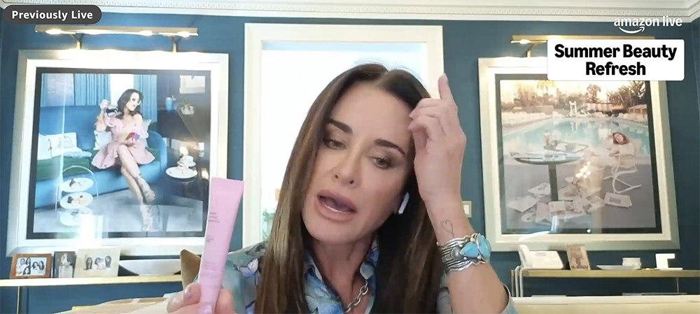 Kyle Richards holding a pink lip mask