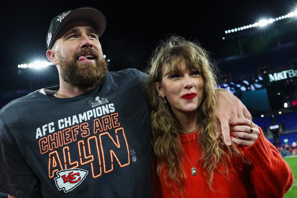 travis kelce with his arm around taylor swift on the football field