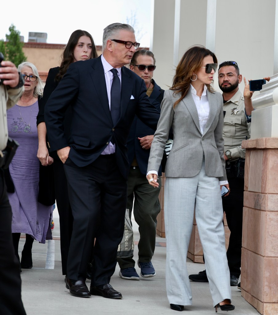 Alec Baldwin walking with Hilaria Baldwin