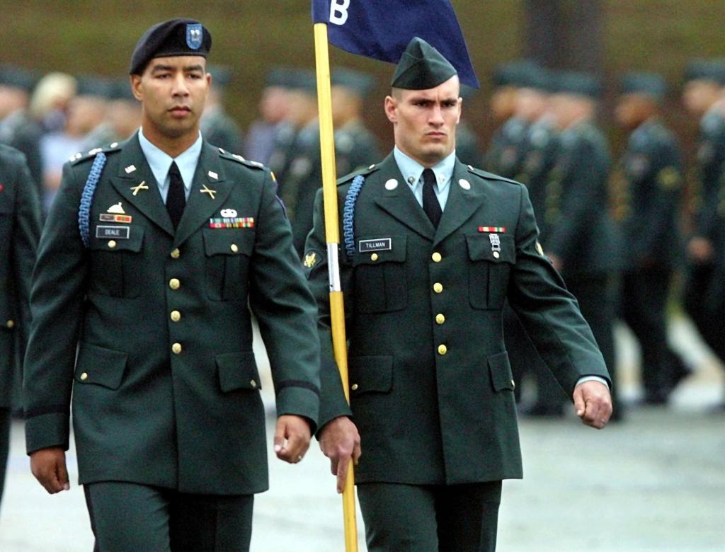 Pat Tillman walks next to Captain Christoper Deale, company commander of B Company 1st BN 19th Infantry Regiment, during graduation ceremonies on October 25, 2002 at Fort Benning, Georgia. 