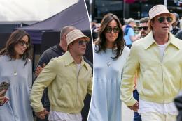 Brad Pitt and girlfriend Ines de Ramon hold hands at British Grand Prix
