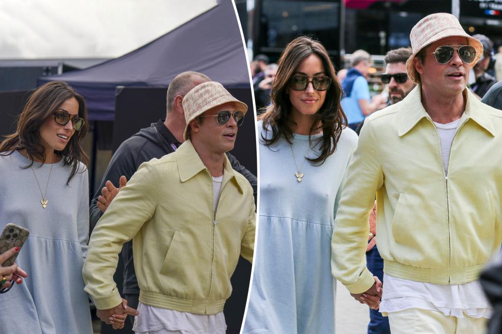 Brad Pitt and girlfriend Ines de Ramon hold hands at British Grand Prix in rare public outing