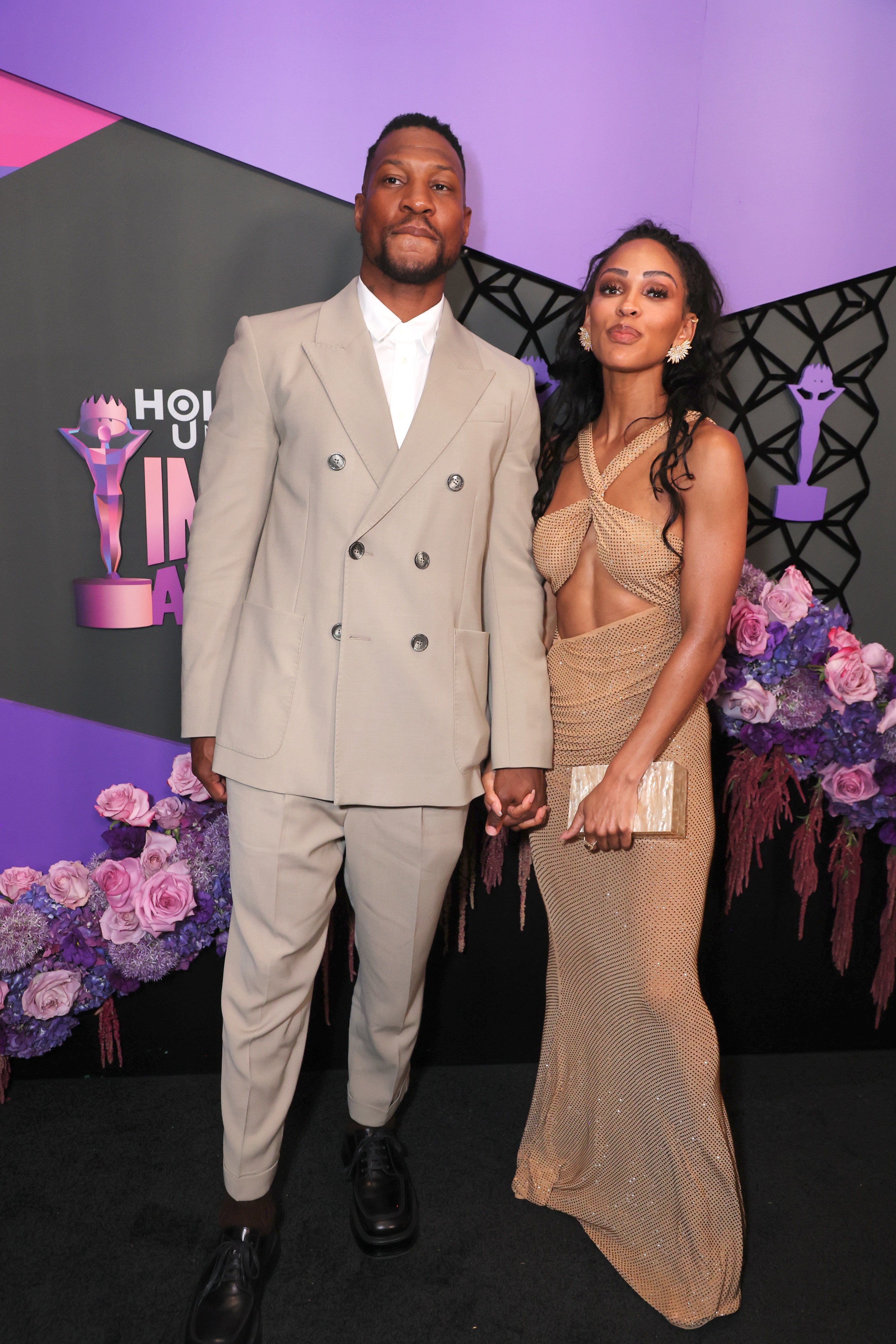 Jonathan Majors and Meagan Good posing together