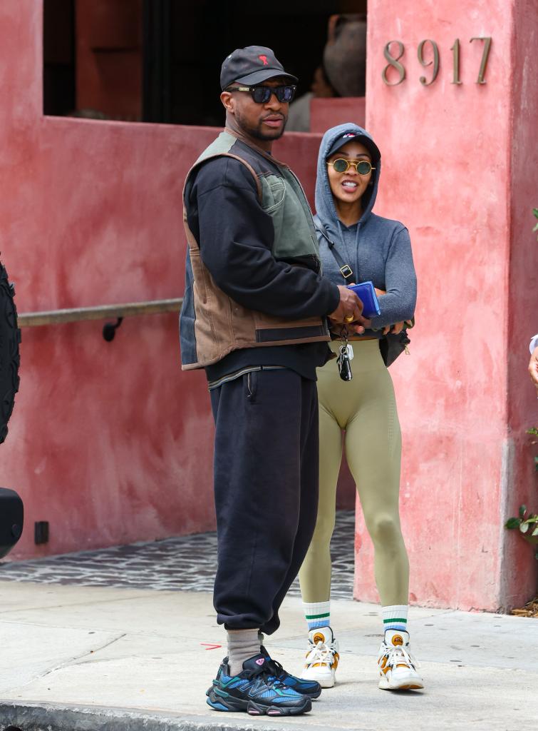 Jonathan Majors and Meagan Good posing together