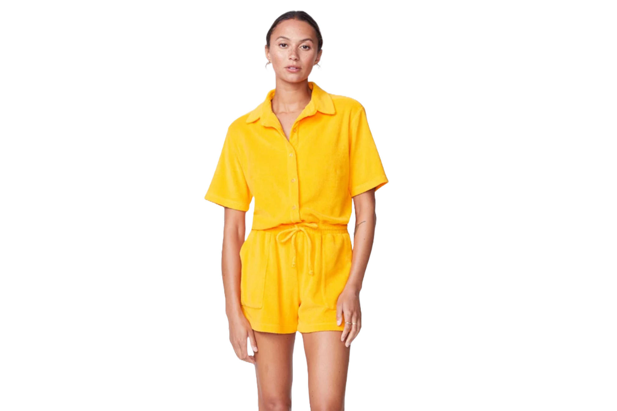 A model in a yellow terry cloth romper